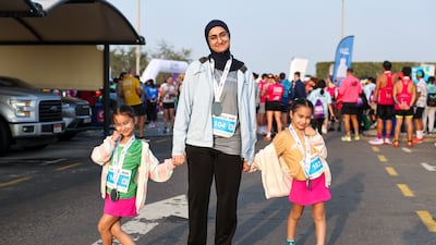 Participants celebrate after taking part in A Run for Hope Guinness World Records attempt on Saadiyat Island