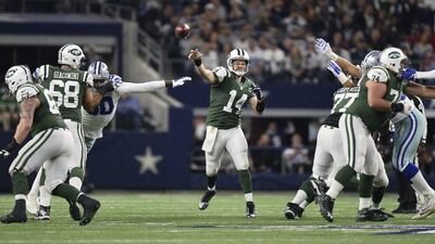 New York Jets quarterback Ryan Fitzpatrick attempts a pass against the Dallas Cowboys in their NFL contest on Saturday night. Larry W Smith / EPA / December 19, 2015