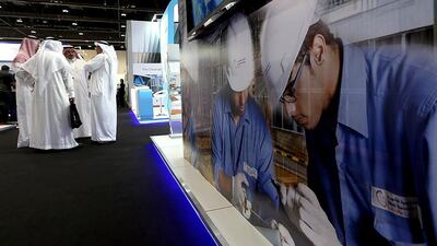 Above, visitors at Saudi Arabia's stand at POWER-GEN Middle East Conference and Exhibition in Abu Dhabi. Satish Kumar / The National