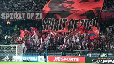 Kashima Antlers fans cheer on their team before the match. Toshifumi Kitamura / AFP