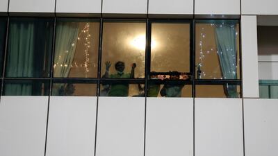 Cricket fans in an apartment outside Sharjah Cricket Stadium.