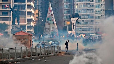 Lebanese protesters, enraged by a deadly explosion, clash with security forces at Martyrs' Square in Beirut. Lebanon's Prime Minister Hassan Diab stepped down amid fury within and outside his government over the deadly Beirut port blast he blamed on the incompetence and corruption of a decades-old ruling class. AFP