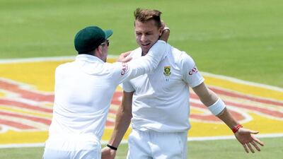 Dale Steyn, right, of South Africa celebrates a wicket against the tourists on Saturday in Pretoria, South Africa. Duif du Toit / Getty Images