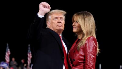 US President Donald Trump gestures next to first lady Melania Trump after speaking at a campaign event for Republican US senators David Perdue and Kelly Loeffler in Valdosta, Georgia, US. Reuters