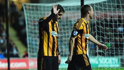 Former Swansea man Danny Graham, left, made a point not to celebrate too enthusiastically after scoring against his former club on Monday, Stu Forster / Getty Images