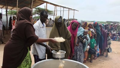 July 26 2011: Somalis from southern Somalia receive food at a feeding centre in Mogadishu, Somalia. The UN's foray into the famine zone is a desperate attempt to reach at least 175,000 of the 2.2 million Somalis whom aid workers have not yet been able to???
