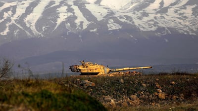 An old Israeli tank is pictured near the Syrian border in the Golan Heights on February 4, 2021. AFP