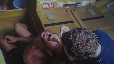 Norwegian skipper Knut Frostad is treated by crew member Alby Pratt in 1997. This photo is part of an exhibition on the history of the Volvo Ocean Race. Delores Johnson / The National