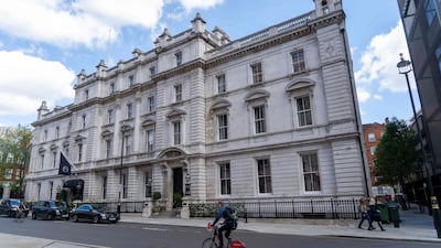 A cyclist passes the exterior of the former Bow Street Police Station, which has been converted into a luxury boutique hotel and also houses the new Bow Street Police Museum, in London's Covent Garden. AFP / Niklas Halle'n