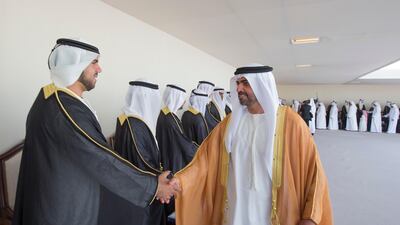 Sheikh Hamed bin Zayed Al Nahyan, the Chairman of Crown Prince Court - Abu Dhabi and Executive Council member, greets grooms at a mass wedding reception in the capital. Ryan Carter / Crown Prince Court - Abu Dhabi