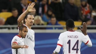 PSG players Zlatan Ibrahimovic, centre, Lucas, left and Blaise Matuidi celebrate after a goal in their 3-0 win over Shakhtar Donetsk in the Champions League on Wednesday. Sergey Dolzhenko / EPA / September 30, 2015