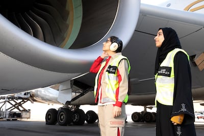 Etihad Airways Technical Engineer Soukaina Sabyh inspects the engine before departure with Safety Manager Reem Almutawwa. Courtesy Etihad Airways