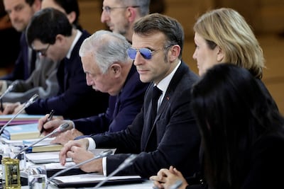 French President Emmanuel Macron leads a meeting at the Elysee Palace in Paris on Monday. Reuters