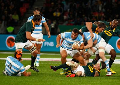 Argentina's captain and hooker Agustin Creevy, centre, runs with the ball. Michael Sheehan / AFP