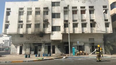 Firefighters contained a blaze that gutted the inside of an abandoned two storey behind Abu Dhabi Media on Monday. Anna Zacharias / The National