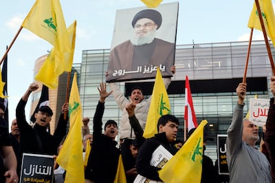 Supporters of Hezbollah say the group should not disarm while Israel continues to attack Lebanon. EPA