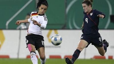Lira Bajramaj, left, fights for the ball with Heather O'Reilly of the US during a women's friendly international football match in Augsburg. Reuters