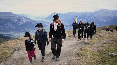 People take part in a ceremony to mark the 'death' of the Pizol glacier (Pizolgletscher) above Mels, eastern Switzerland. AFP