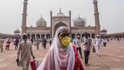 An Indian Muslim woman wearing a protective mask leaves after attending congregational Friday prayers at the historic Jama Masjid (Grand Mosque) amid the government imposing restriction on assembly of more than 20 people over the coranavirus threat in Delhi, India. Getty Images