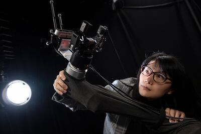 Prof Yang Gao is developing a robotic arm system to use in the race to solve the problem of space junk. Photo: Max Alexander