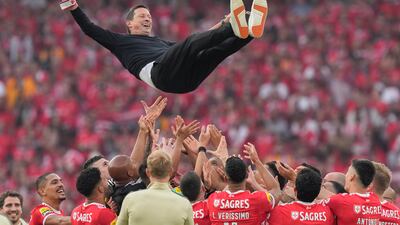 Benfica's coach Roger Schmidt is thrown in the air after his team beat Santa Clara to win the Portuguese Primeira Liga at the Luz stadium in Lisbon. AP Photo