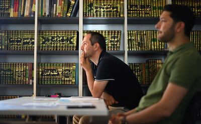 Students listen during a lesson at the Islamic college on Monday. AFP