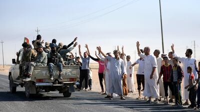 Members of Kirkuk's Arab population greet Hashed Al Shaabi fighters as they advance into central Kirkuk on October 16, 2017. The mainly Shiite paramilitary forces have been accused of human rights violations. Murtaja Lateef / EPA