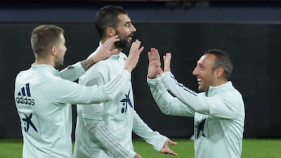 Spain's Inigo Martinez Berridi, left, Raul Albiol, centre, and Santiago Cazorla at the Ramon de Carranza Stadium. AFP