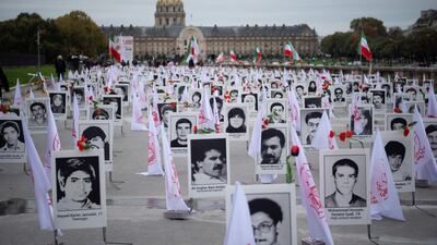 Some 800 portraits of victims have been displayed by representatives in France of the People's Mujahedin of Iran on the Esplanade des Invalides in Paris on October 29, 2019 to commemorate the executions of thousands of Iranian political prisoners in 1988 AFP