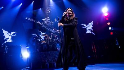 Ozzy Osbourne of Black Sabbath performs with guitarist Tony Iommi, seen on screen behind, during a concert in Denmark last year. AP photo