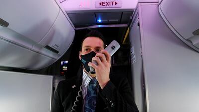 In-flight service manager Craig Suckling makes an announcement before disembarking from Air New Zealand Flight 246 in Wellington. Getty