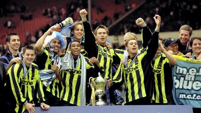 City's players celebrate their success.