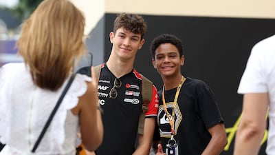 A young fan takes a photo with Haas driver Oliver Bearman at the Abu Dhabi Grand Prix 2025. Chris Whiteoak / The National