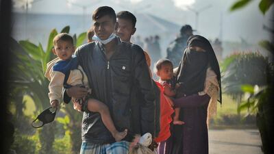 Rohingya refugees carry children and walk with their belongings to be relocated to to the island of Bhasan Char, in Chattogram, Bangladesh, Friday, January 29, 2021. File photo / AP Photo