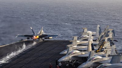 An F/A-18E Super Hornet launches from the USS Abraham Lincoln, which is operating off Oman. US Navy