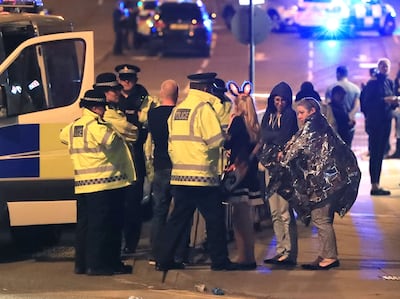 Police attend to members of the public caught up in the Manchester Arena bombing. Photo: Peter Byrne