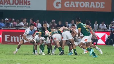 A South Africa player passes the ball to a teammate.