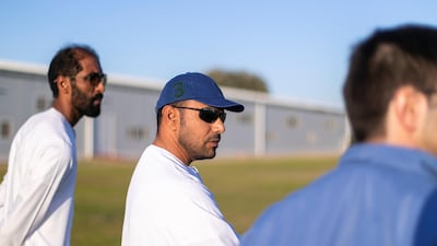 Emirati horse trainer Salem bin Ghadayer, centre, inspects the horses at Fazza Racing Stables. Reem Mohammed / The National