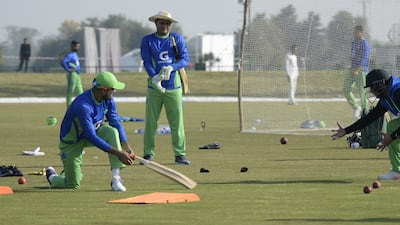 Pakistan players take part in catching practice. EPA