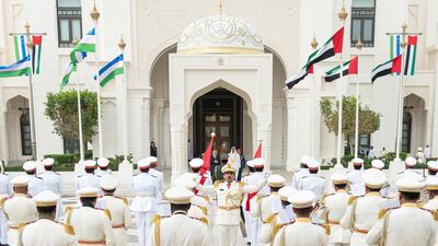 Sheikh Mohamed bin Zayed and Mr Mirziyoyev stand for the national anthem.