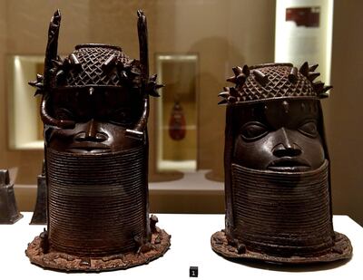 Heads of a Royal ancestor, arts of the Kingdom of Benin of the end of the 18th century are on display on June 18, 2018 at the Quai Branly Museum-Jacques Chirac in Paris. Benin is demanding restitution of its national treasures that had been taken from the former French colony Dahomey (current Benin) to France and currently are on display at Quai Branly, a museum featuring the indigenous art and cultures of Africa. / AFP / GERARD JULIEN