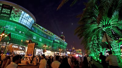 People walk on Tahlia street in the Saudi capital Riyadh. The kingdom is raising $12bn in a bond sale. AFP/Fayez Nureldine
