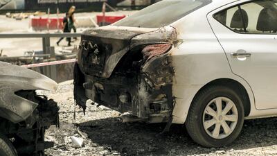 Cars parked under Torch tower bore the brunt of the falling debris. Reem Mohammed / The National.
