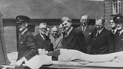 Minister for health Aneurin Bevan watches a demonstration of a new stretcher in Preston, on the first day of the new National Health Service. Getty Images