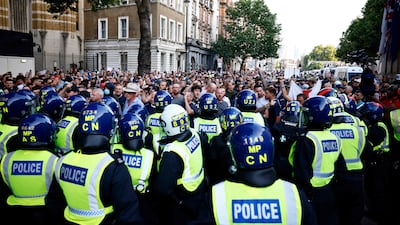 Police officers kettle protestors during the 'Enough is Enough' demonstration outside Downing Street in central London. AFP