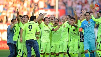 Barcelona players in full celebration after victory over Atletico Madrid secured the Primera Liga title. Denis Doyle / Getty