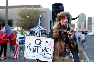 Jake Angeli, a Qanon believer, speaks to a crowd of Donald Trump supporters in Phoenix in November. AP Photo
