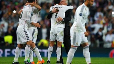 Carlo Ancelotti celebrates with Cristiano Ronaldo after Real Madrid progressed to the Uefa Champions League semi-finals. Gonzalo Arroyo Moreno / Getty