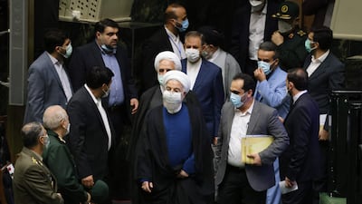 Iran's outgoing president, Hassan Rouhani (centre), arrives at the swearing in ceremony for Iran's new president at the parliament in the Islamic republic's capital Tehran.