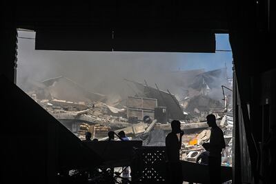 Palestinians inspect the rubble of their destroyed house after an Israeli strike in Gaza city. EPA